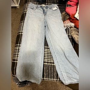 Relaxed straight leg jeans; has small stain on back right side